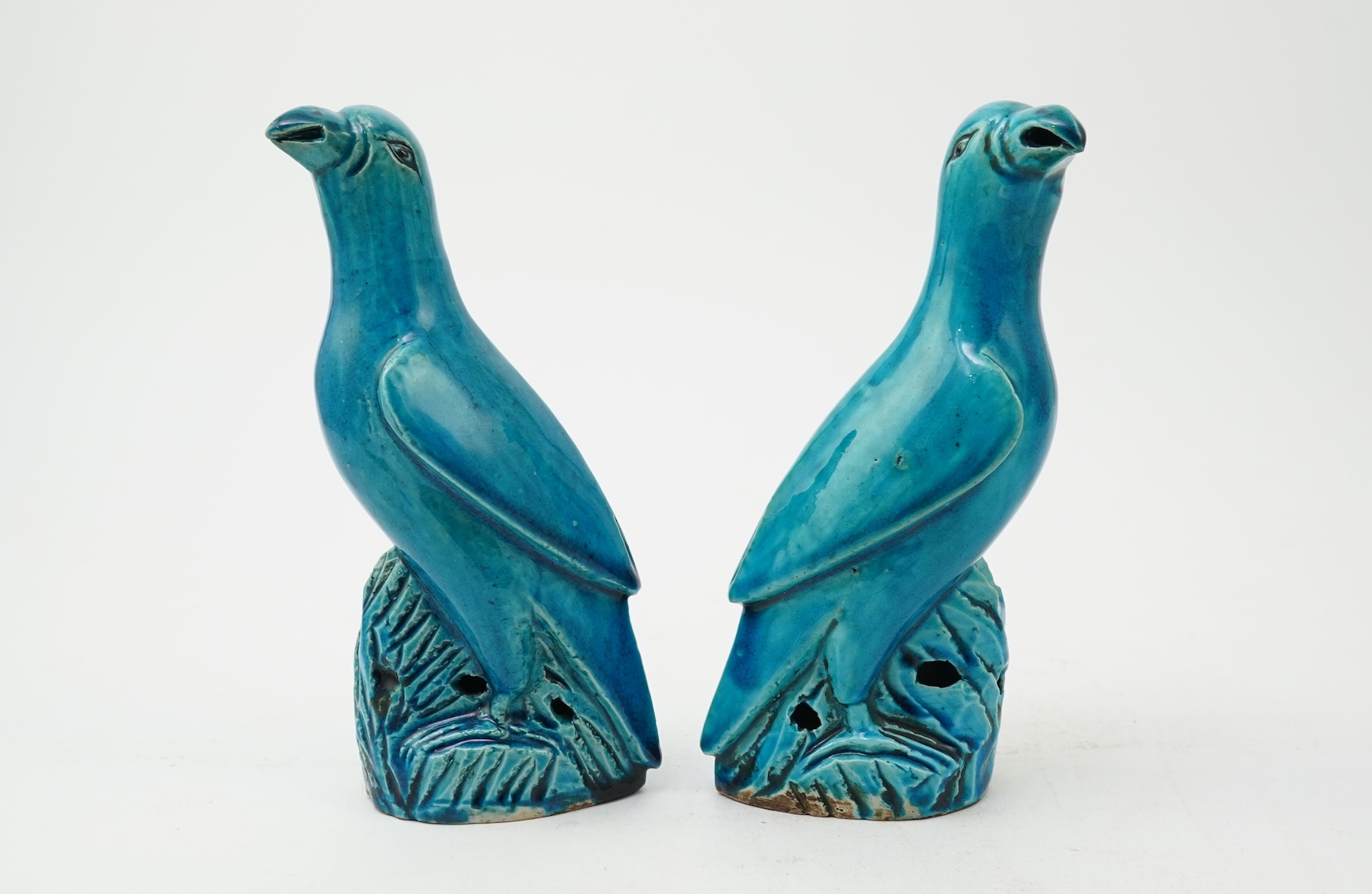 A pair of Chinese turquoise glazed models of parrots, 18th century